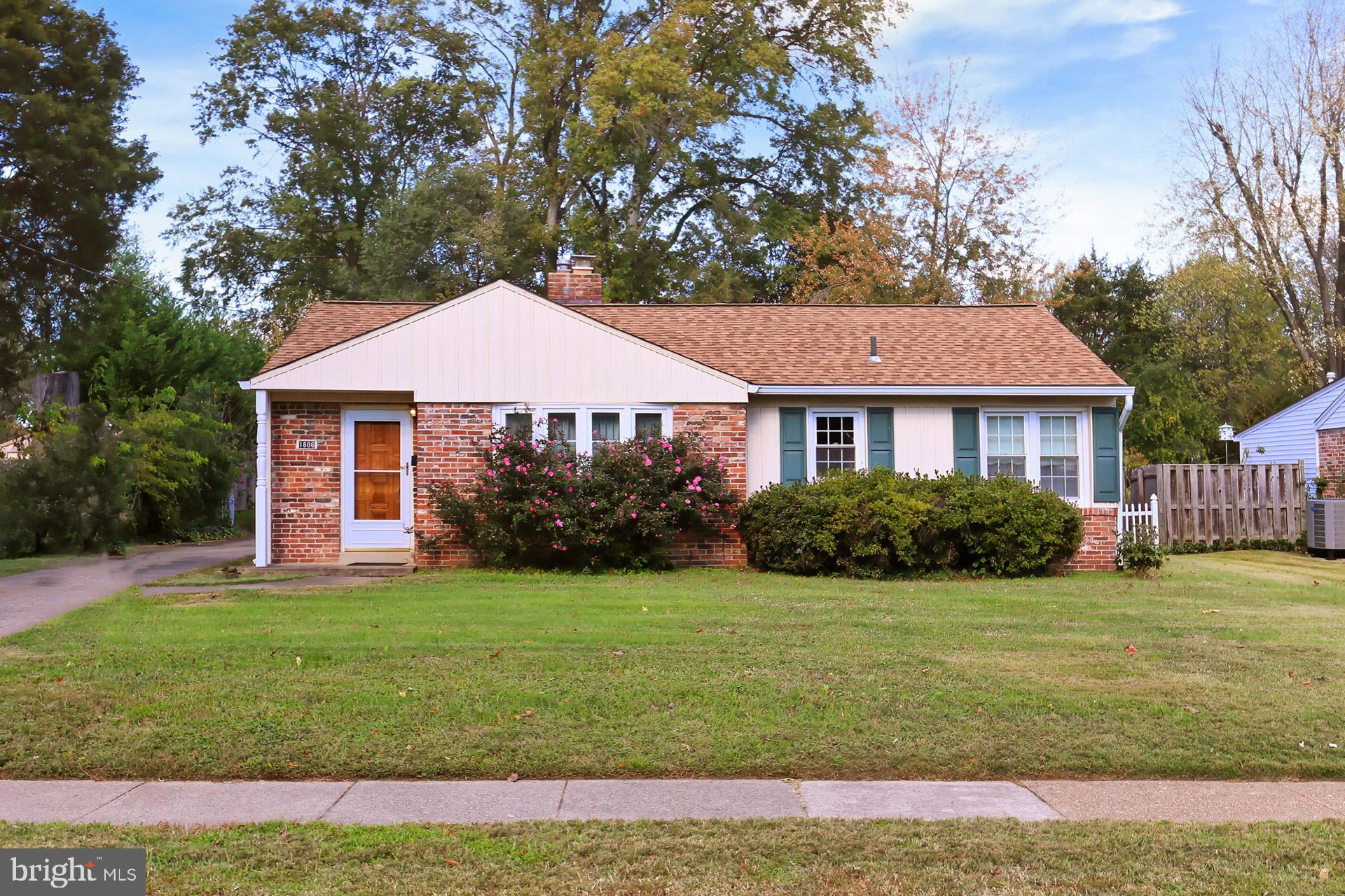 1806 Shenandoah Road Alexandria, VA 22308 - Photo 1 of 33 a front view of a house with a yard and trees
