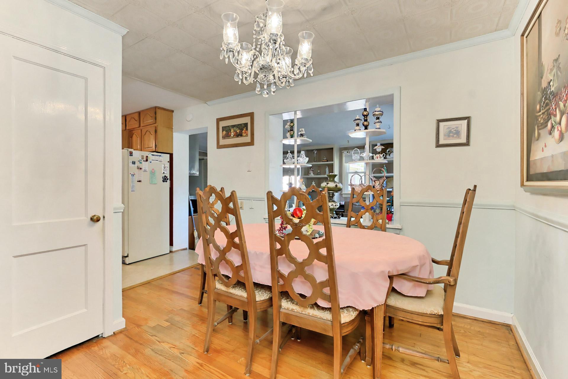 1806 Shenandoah Road Alexandria, VA 22308 - Photo 16 of 33 a view of a dining room with furniture and chandelier