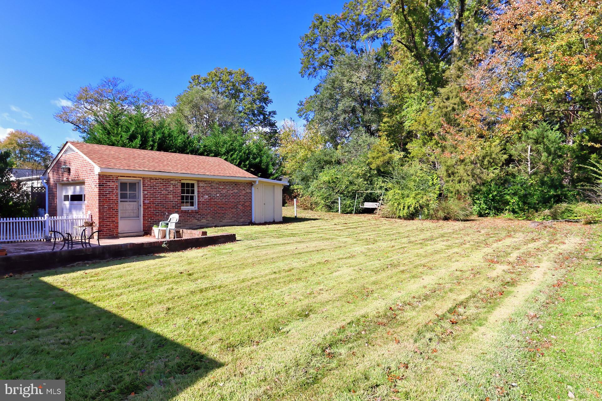 1806 Shenandoah Road Alexandria, VA 22308 - Photo 29 of 33 a front view of a house with a garden