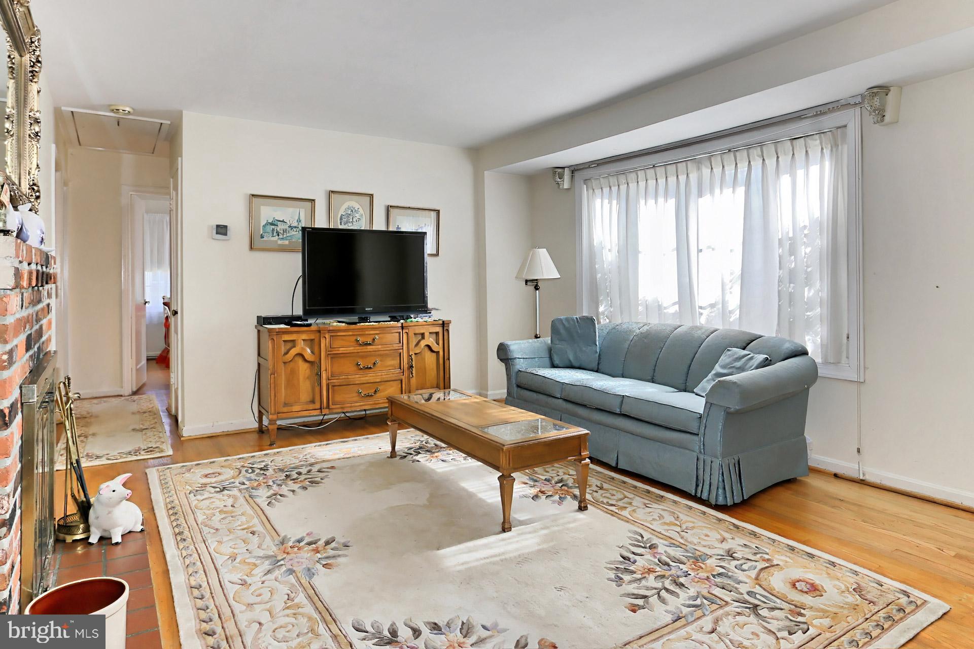 1806 Shenandoah Road Alexandria, VA 22308 - Photo 6 of 33 a living room with furniture and a flat screen tv