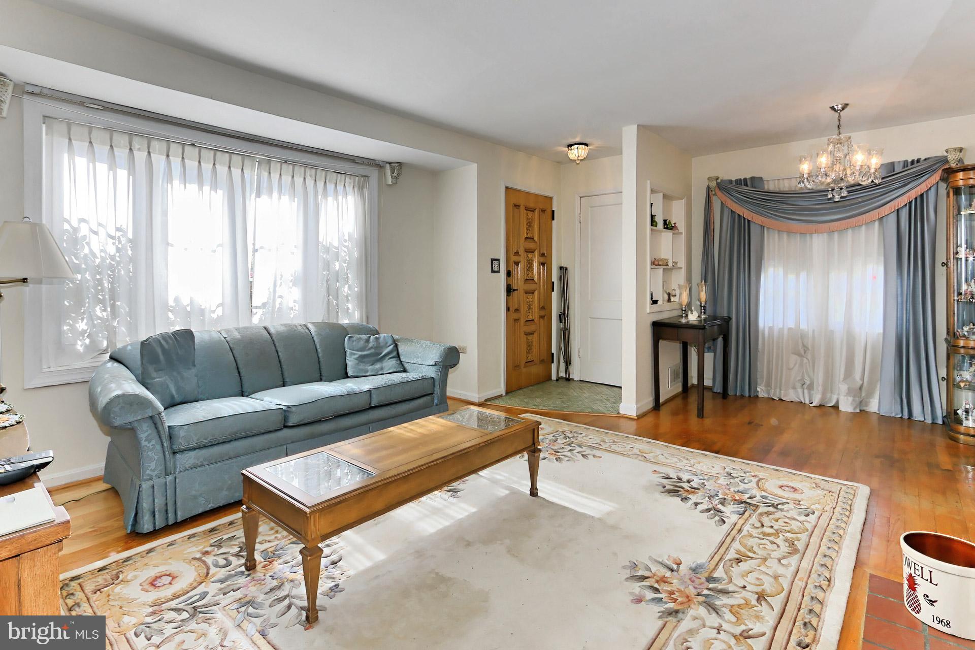 1806 Shenandoah Road Alexandria, VA 22308 - Photo 7 of 33 a living room with furniture and a chandelier