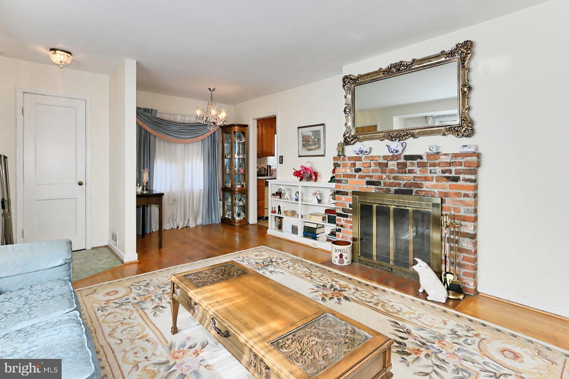 1806 Shenandoah Road Alexandria, VA 22308 - Photo 8 of 33 a living room with a couch and a table in it