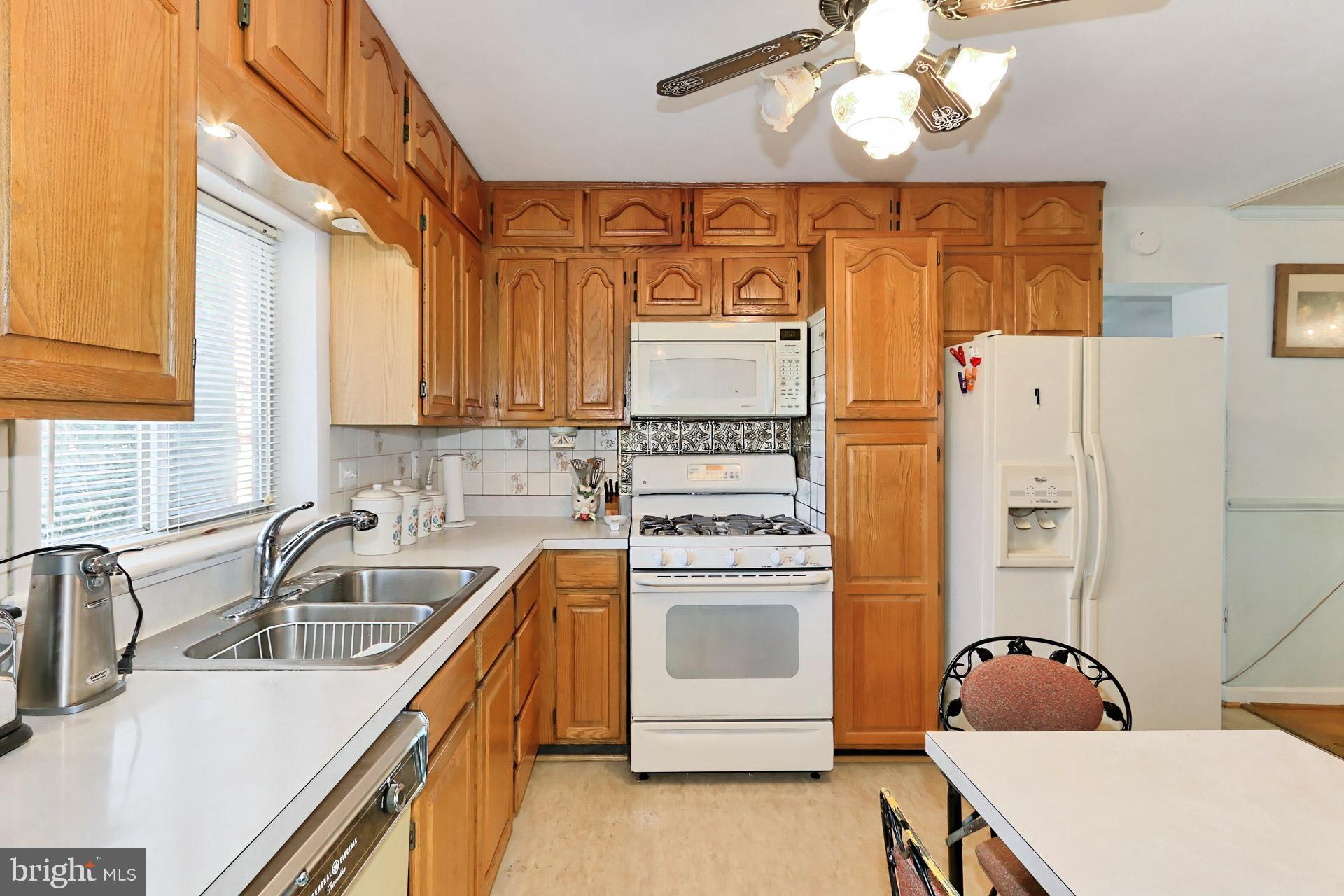 1806 Shenandoah Road Alexandria, VA 22308 - Photo 10 of 33 a kitchen with stainless steel appliances granite countertop a sink a stove and refrigerator