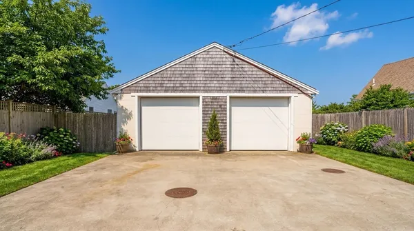 a view of a house with a yard and garage