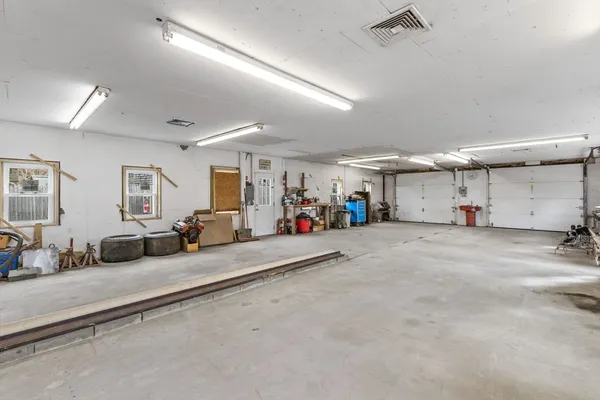 a view of a livingroom with furniture and a window