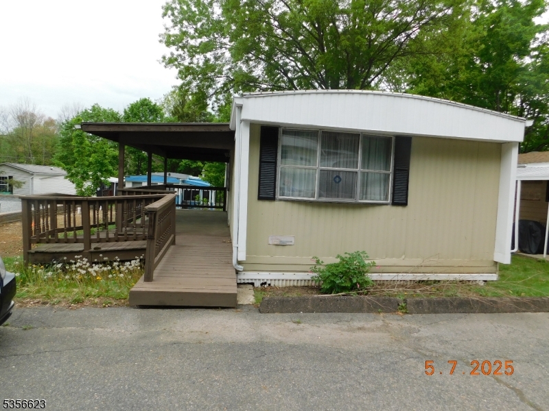 46 Back Street Oxford, NJ 07863 - Photo 1 of 2 a wooden bench sitting in front of a building