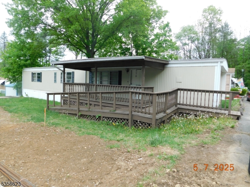 46 Back Street Oxford, NJ 07863 - Photo 2 of 2 a view of backyard with wooden fence and trees