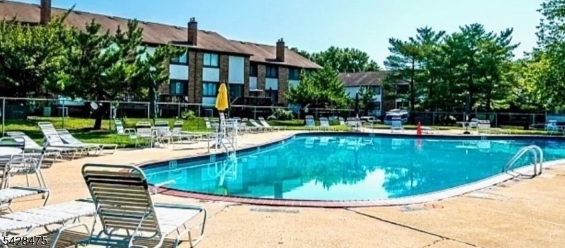 1030 Robin Road Hillsborough, NJ 08844 - Photo 22 of 22 a view of a swimming pool with a lounge chairs