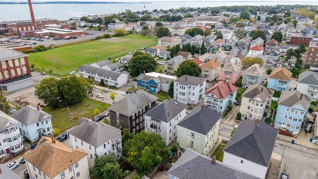 an aerial view of residential houses with outdoor space