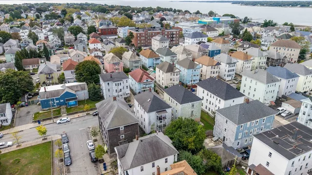 an aerial view of residential houses with outdoor space