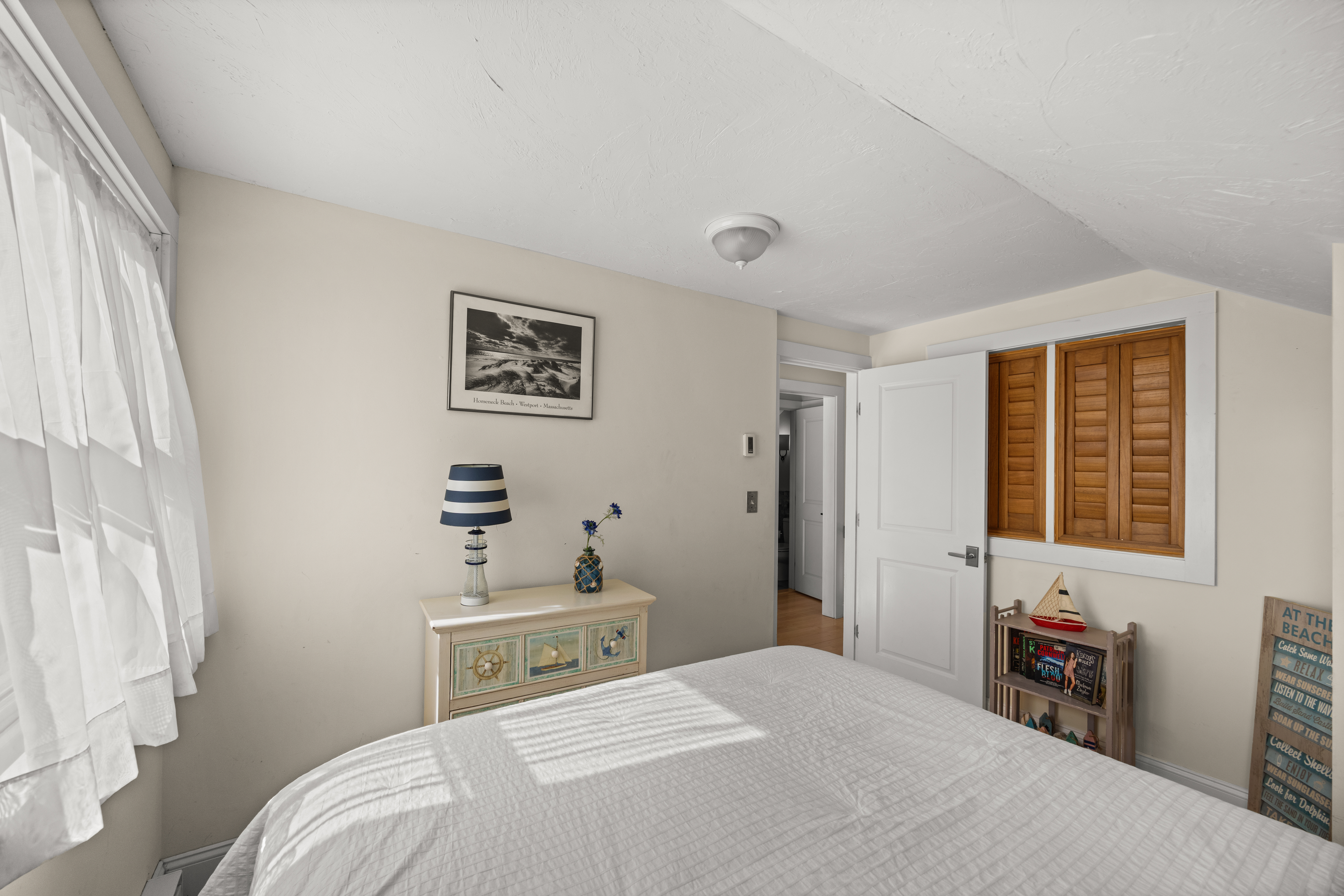 58 Rd To The Plaines Edgartown, MA 02539 - Photo 36 of 40 a bedroom with a bed and a window
