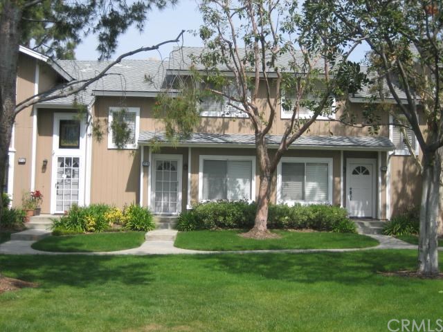 314 Monroe, Unit 172 Irvine, CA 92620 - Photo 1 of 1 a front view of a house with a garden