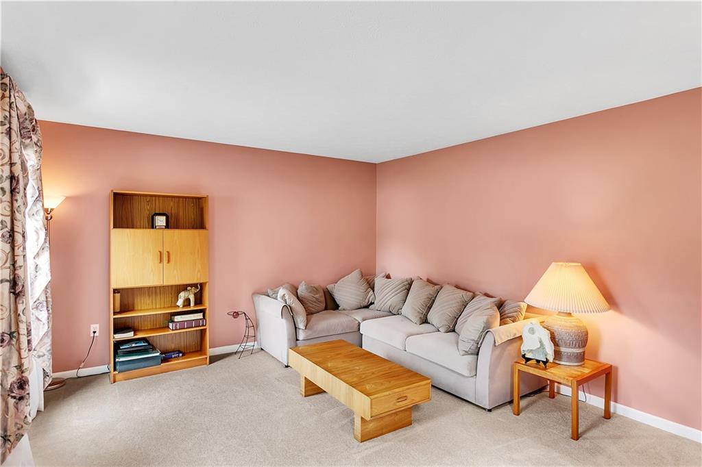 229 Field Club Circle McKees Rocks, PA 15136 - Photo 11 of 34 a living room with furniture and a couch