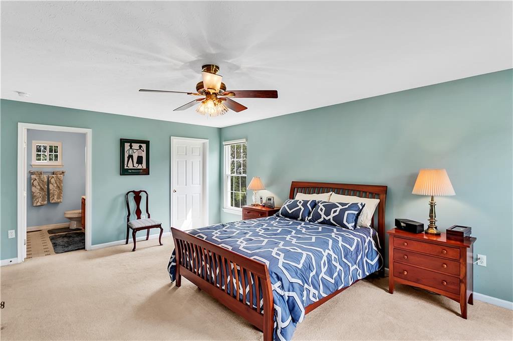 229 Field Club Circle McKees Rocks, PA 15136 - Photo 17 of 34 a bedroom with a bed and a chandelier