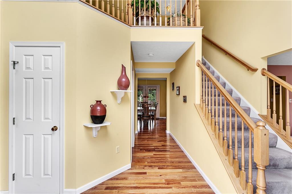 229 Field Club Circle McKees Rocks, PA 15136 - Photo 2 of 34 a view of a hallway with wooden floor and entryway