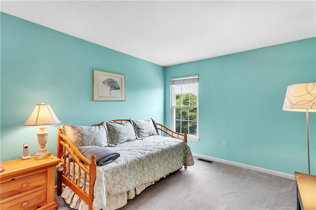 229 Field Club Circle McKees Rocks, PA 15136 - Photo 21 of 34 a bedroom with a bed and lamp