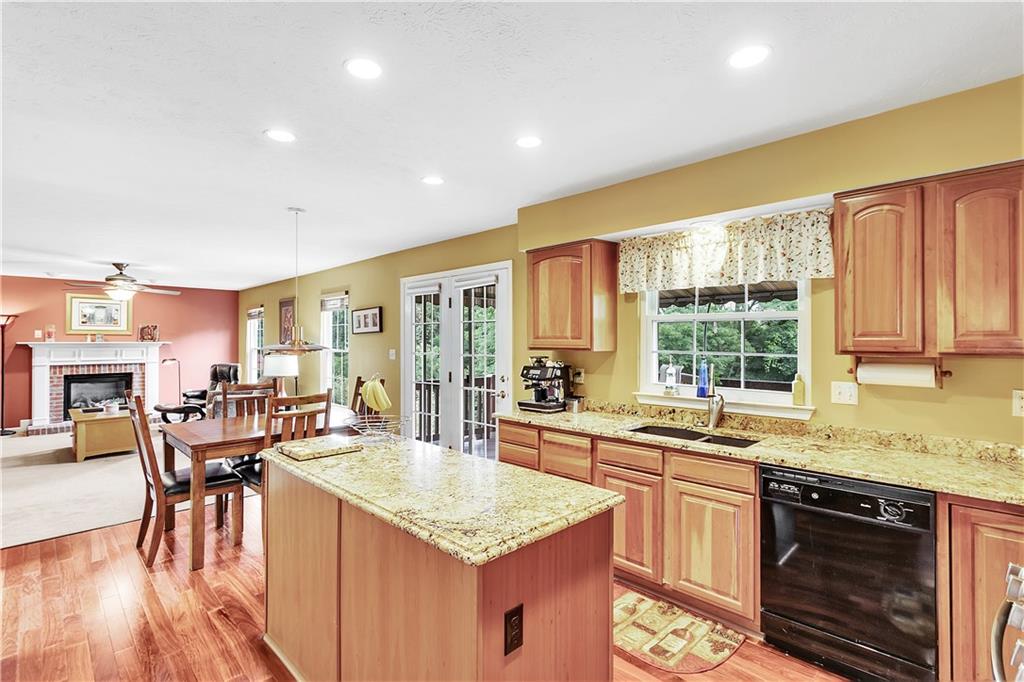 229 Field Club Circle McKees Rocks, PA 15136 - Photo 3 of 34 a kitchen with lots of counter top space and dining table