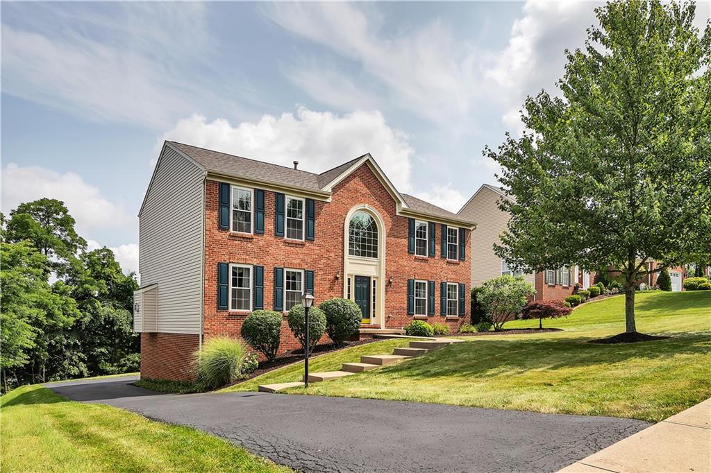 229 Field Club Circle McKees Rocks, PA 15136 - Photo 34 of 34 a front view of a house with a yard garage and outdoor seating