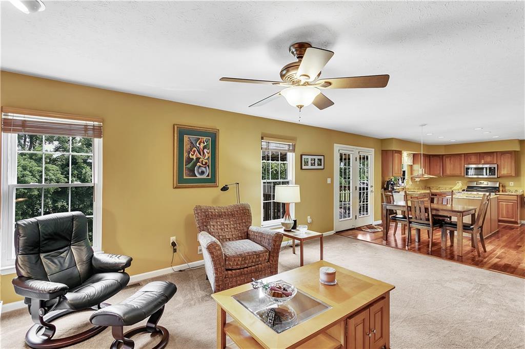 229 Field Club Circle McKees Rocks, PA 15136 - Photo 8 of 34 a living room with furniture a table and a window