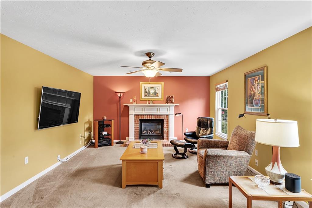 229 Field Club Circle McKees Rocks, PA 15136 - Photo 9 of 34 a living room with furniture and a fireplace