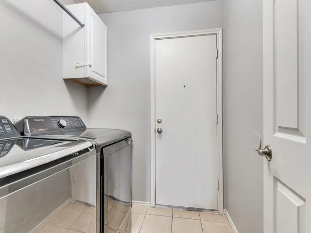 a view of a backyard with seating space