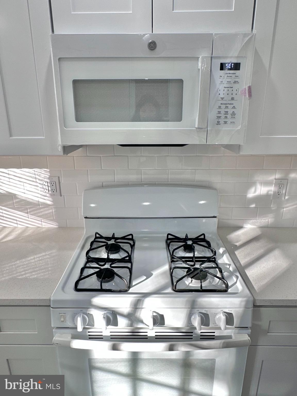 934 North Fallon Street Philadelphia, PA 19131 - Photo 12 of 26 a kitchen with a stove and microwave