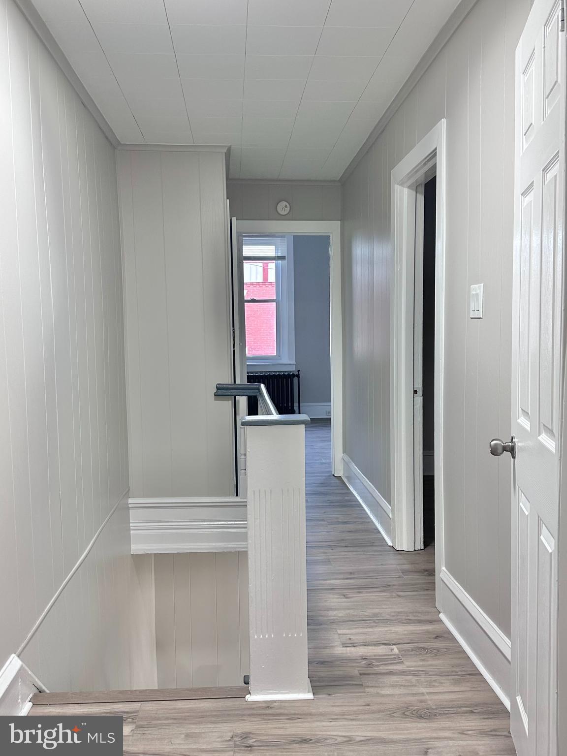 934 North Fallon Street Philadelphia, PA 19131 - Photo 15 of 26 a view of a hallway with wooden floor and staircase