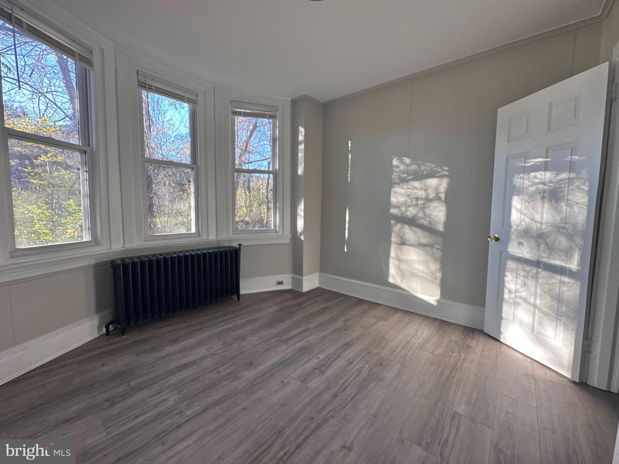 934 North Fallon Street Philadelphia, PA 19131 - Photo 19 of 26 an empty room with wooden floor and windows