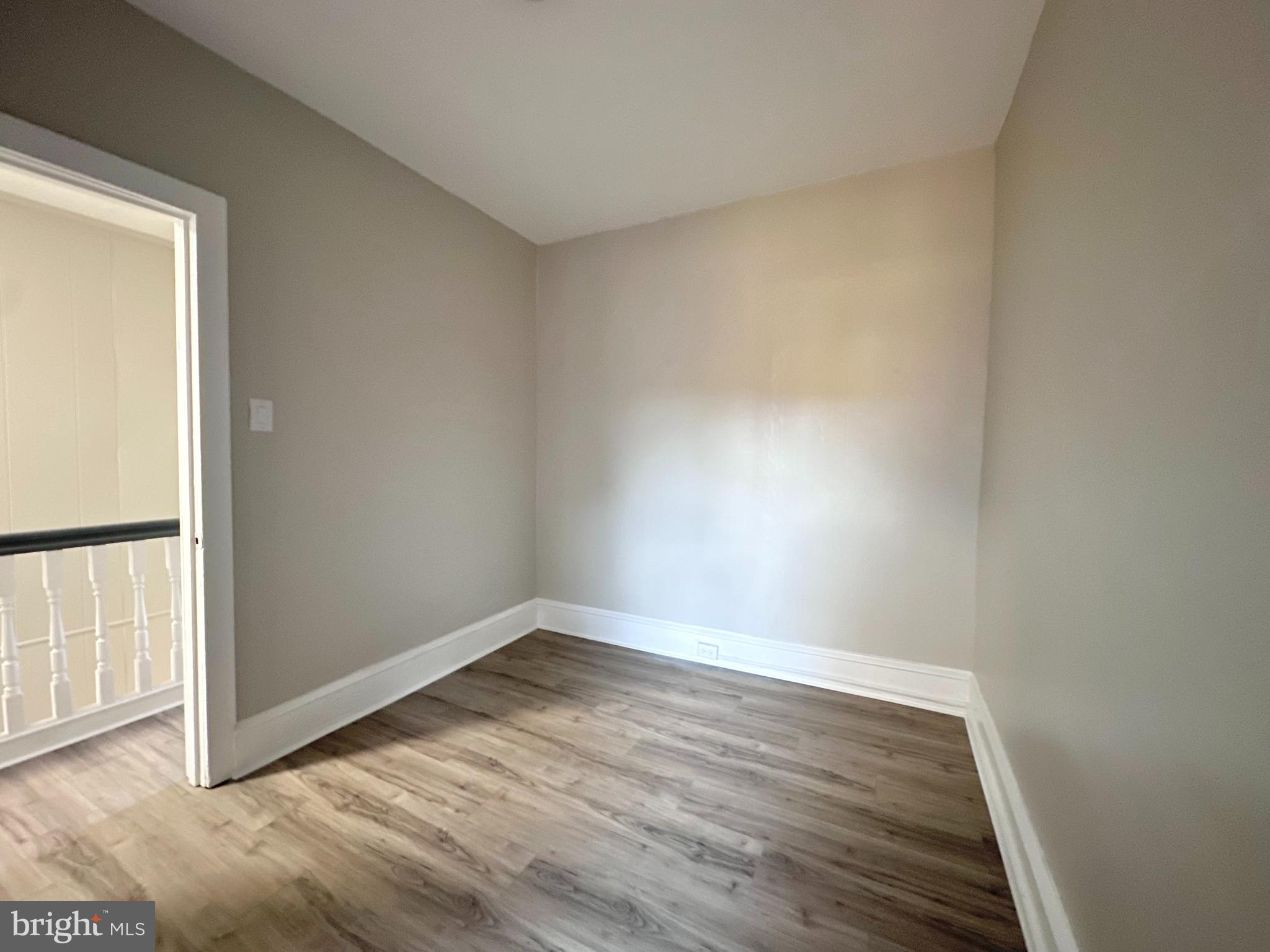 934 North Fallon Street Philadelphia, PA 19131 - Photo 22 of 26 a view of an empty room with wooden floor and a window