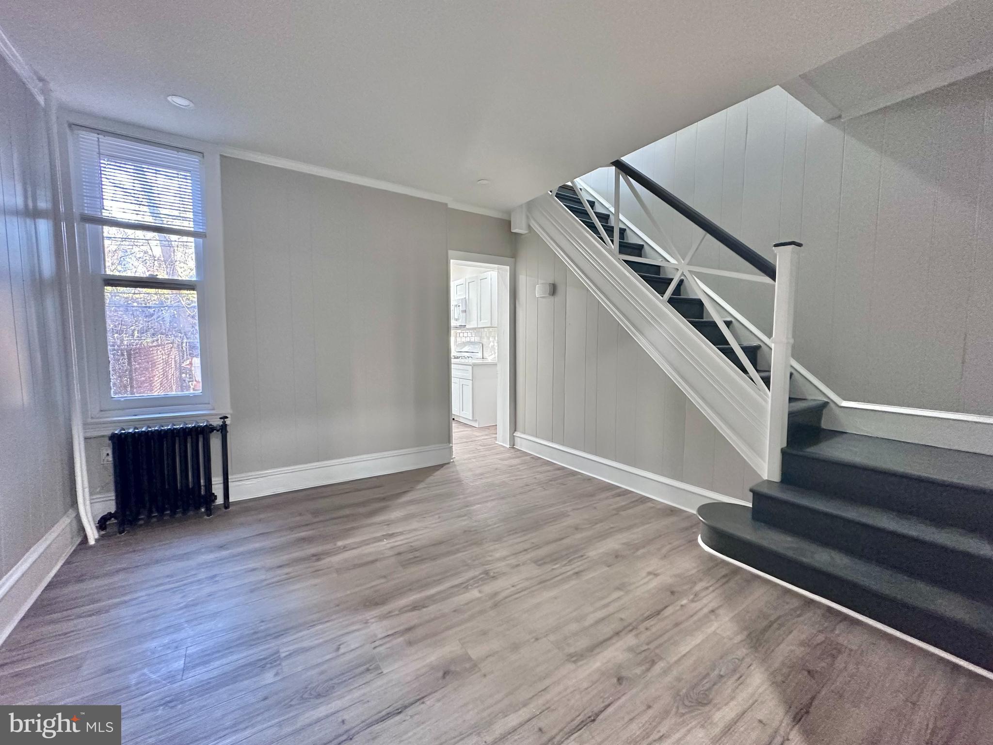 934 North Fallon Street Philadelphia, PA 19131 - Photo 7 of 26 wooden floor in an empty room with a window