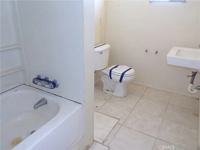 a bathroom with a sink and a toilet