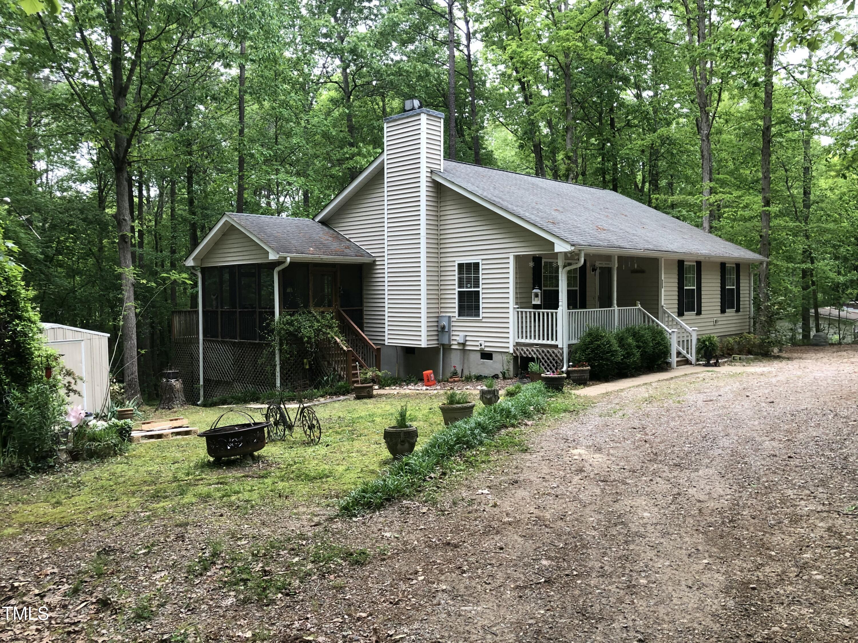 709 Oak Ridge Drive Cary, NC 27519 - Photo 28 of 30 a view of a house with backyard and garden