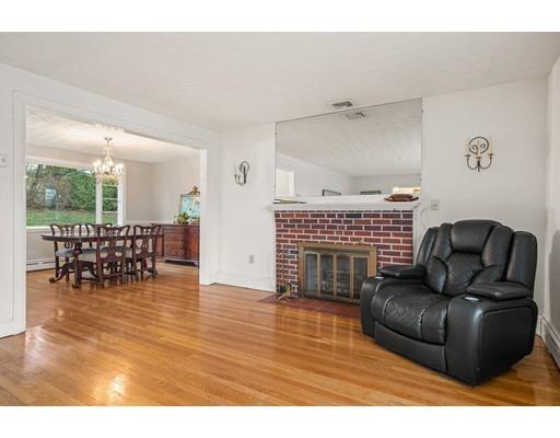 25 Windmill Lane Arlington, MA 02474 - Photo 27 of 39 a living room with furniture and a fireplace