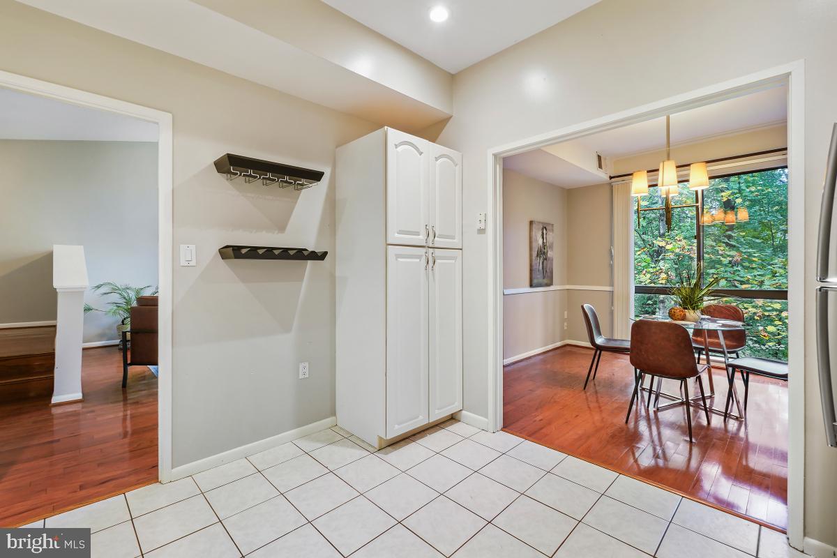 2102 Green Watch Way, Unit 301 Reston, VA 20191 - Photo 18 of 32 a view of a livingroom with furniture and hardwood floor