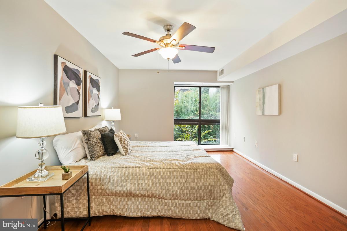 2102 Green Watch Way, Unit 301 Reston, VA 20191 - Photo 24 of 32 a bedroom with a bed and window