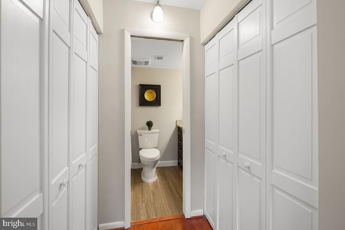 2102 Green Watch Way, Unit 301 Reston, VA 20191 - Photo 26 of 32 a bathroom with a toilet and a shower