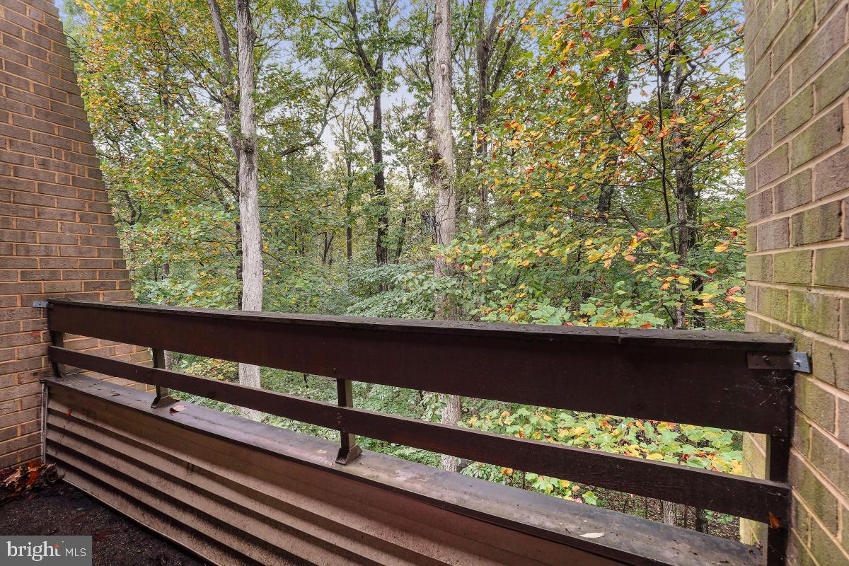 2102 Green Watch Way, Unit 301 Reston, VA 20191 - Photo 29 of 32 a view of a wooden bench and a couple of benches