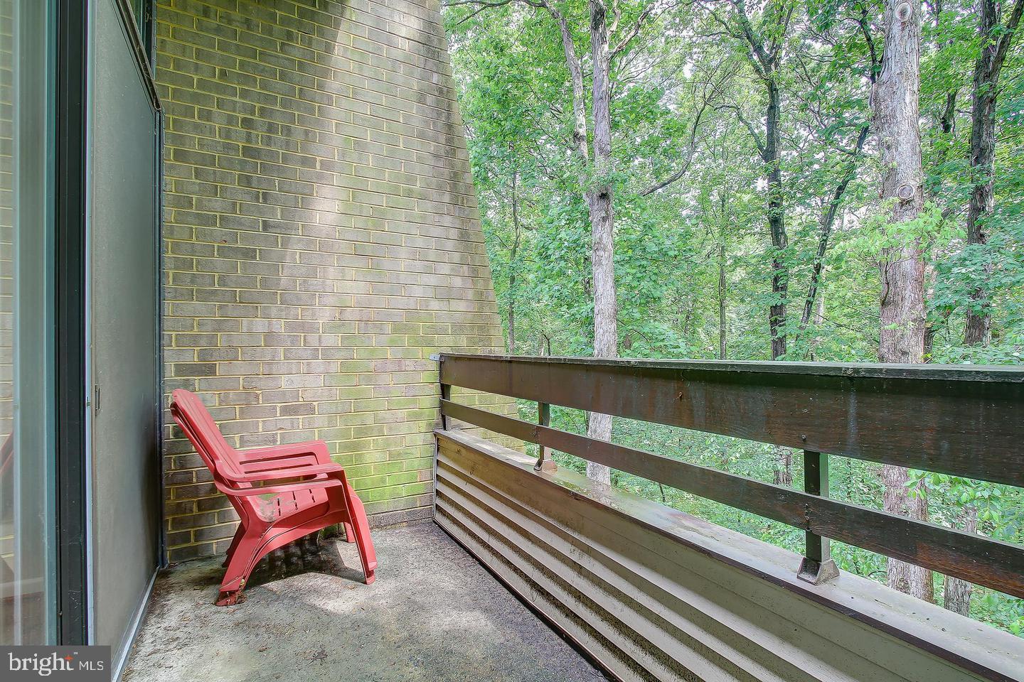 2102 Green Watch Way, Unit 301 Reston, VA 20191 - Photo 30 of 32 a bench sitting on top of a wooden floor