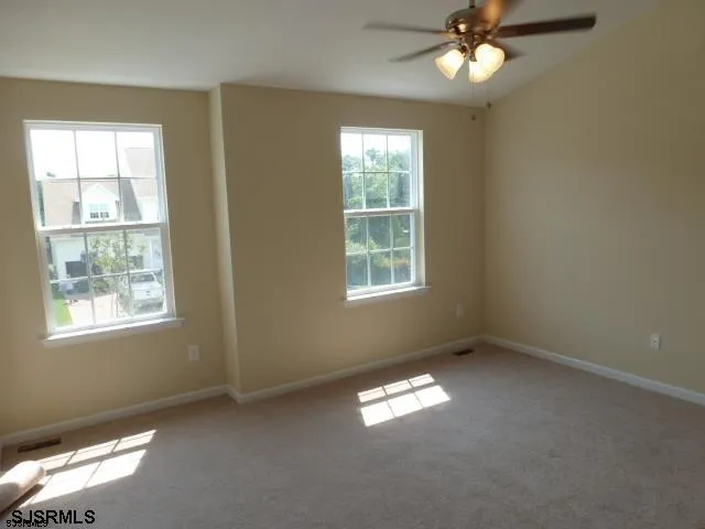 a view of empty room with windows