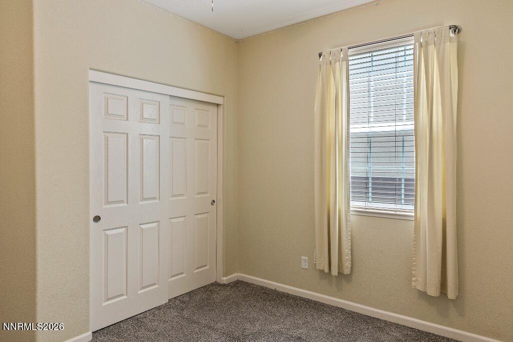 1864 Wind Ranch Road, Unit B Reno, NV 89521 - Photo 26 of 42 a view of a room that has a window in it