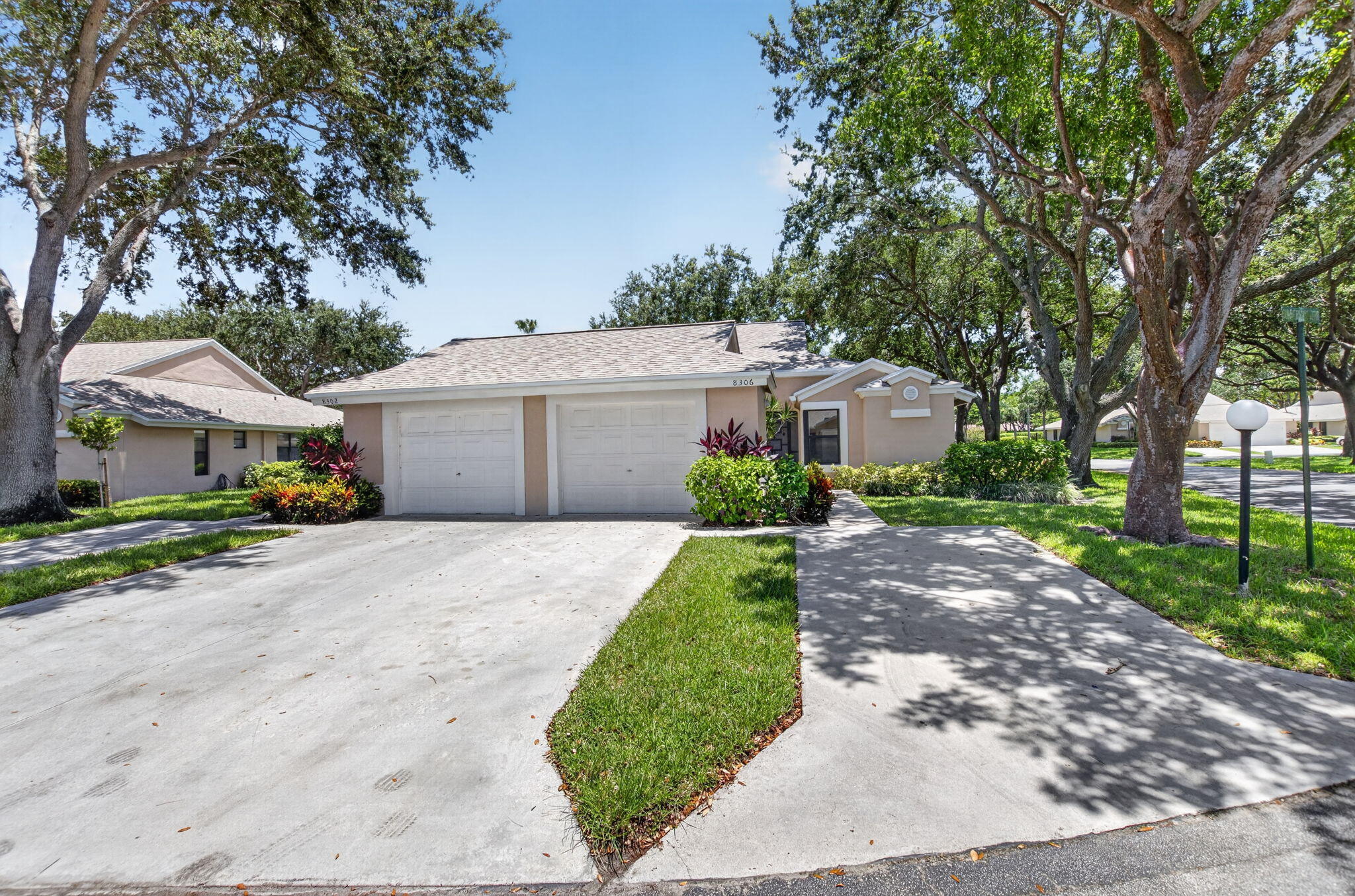 8306 Summersong Terrace Boca Raton, FL 33496 - Photo 5 of 51 front view of a house with a yard