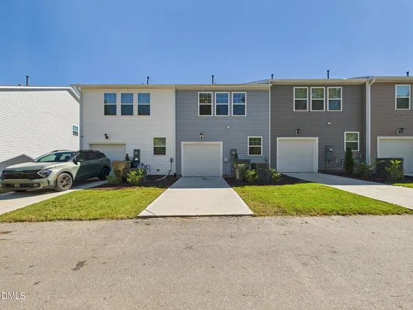 an aerial view of a house with entryway front of it