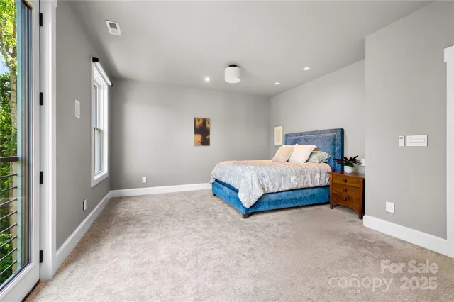 a bedroom with a bed and a view of bathroom