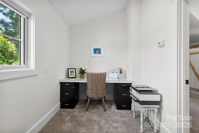 a room with a desk and a window