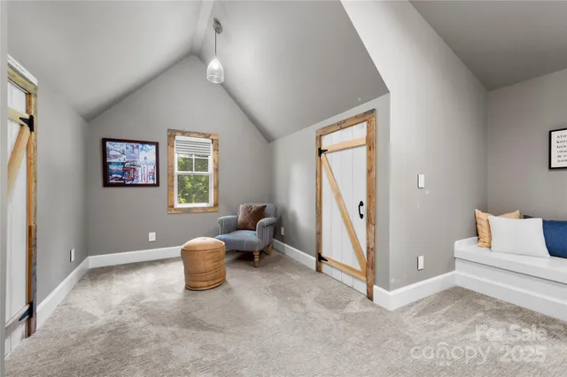 a bedroom with furniture and a window