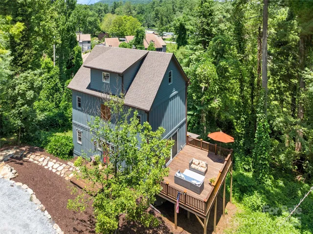 an aerial view of a house with a garden