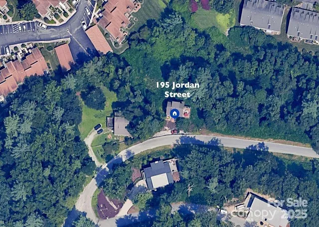 an aerial view of house with yard
