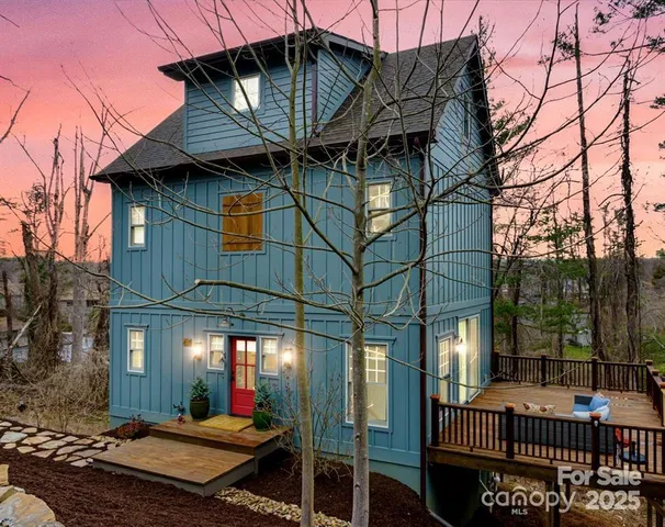 a view of a roof deck with couches and wooden floor