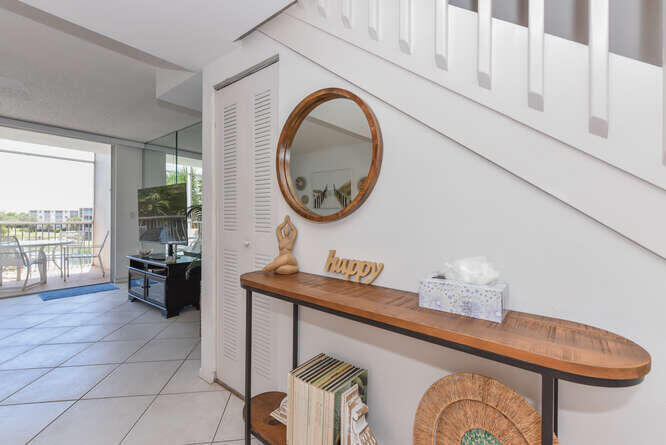 353 Highway 1, Unit F306 Jupiter, FL 33477 - Photo 20 of 43 a bathroom with a sink and a mirror