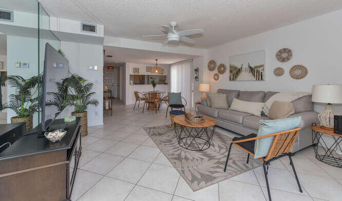 353 Highway 1, Unit F306 Jupiter, FL 33477 - Photo 21 of 43 a living room with furniture and a chandelier